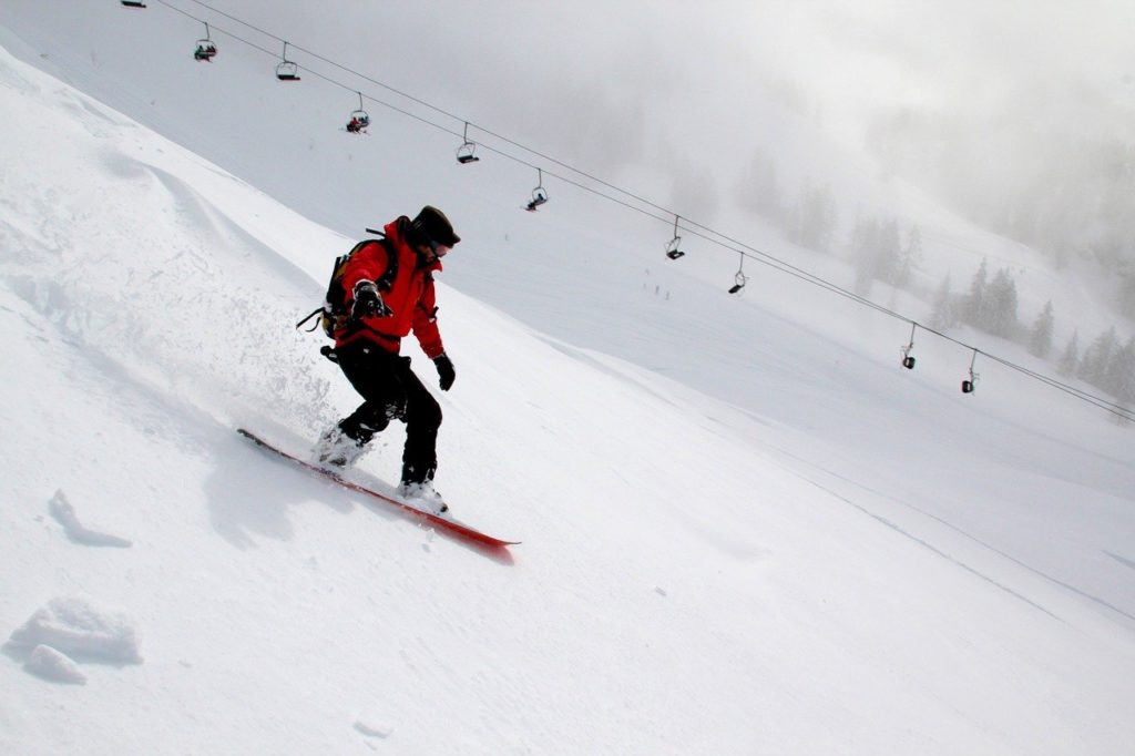 Snowboarding down mountain